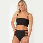 Woman wearing a black bikini with a white background